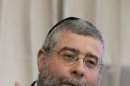 Rabbi Pinchas Goldschmidt, president of the Conference of European Rabbis, gestures during a news conference in Berlin, Germany, Thursday, July 12, 2012. The Conference of European Rabbis has called an emergency meeting in Berlin this week to discuss a German court ruling that circumcising young boys for religious reasons amounts to bodily harm even if parents agree to it. (AP Photo/Gero Breloer)