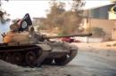 An image from a video made available on October 9, 2014, by the official media outlet of Benghazi-based Islamist Ansar al-Sharia group, al-Raya Media Foundation, allegedly shows a tank belonging to the group during a battle in Benghazi, Libya