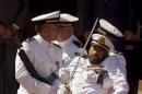 A Spanish Navy officer is carried away after he fainted during a graduation ceremony presided by Spain's King Felipe VI, for new sergeants at the NCO School of the Spanish Navy in San Fernando