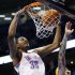 Oklahoma City Thunder forward Kevin Durant (35) dunks in front of Denver Nuggets center Chris Anderson, right, in the fourth quarter of an NBA basketball game in Oklahoma City, Sunday, Feb. 19, 2012. Oklahoma City won 124-118 in overtime. (AP Photo/Sue Ogrocki)