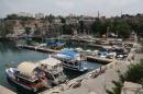 Tourists boats are seen in the harbour of the old city center of the Mediterranean resort city of Antalya