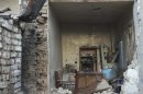 A view of a damaged house in the city of Homs