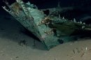 This photo provided by the NOAA Okeanos Explorer Program shows oxidized copper hull sheathing and possible draft marks visible on the bow of a wrecked ship in the Gulf of Mexico about 170 miles from Galveston, Texas. Officials with Texas A&M University at Galveston and Texas State University say the recovery expedition of the two-masted ship that may be 200-years-old, concluded Wednesday, July 24, 2013. They've been able to recover some items like ceramics and bottles, including liquor bottles, and an octant, a navigational tool. Other items spotted among the wreckage are muskets, swords, cannons and clothing. (AP Photo/NOAA Okeanos Explorer Program)