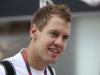 Red Bull driver Sebastian Vettel of Germany arrives at the paddock on the Marina Bay City Circuit for Sunday's Singapore Formula One Grand Prix in Singapore, Thursday, Sept. 22, 2011. (AP Photo/Terence Tan)