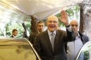 Lebanese former minister Tammam Salam gestures to his supporters in front of his house while going to the presidential palace in Baabda