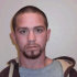 In this undated photo taken by the Washington state Department of Corrections and provided by the Port Angeles Police Department, Travis A. Nicolaysen is seen. The Port Angeles man is on the lam but still updating his Facebook page. Nicolaysen, 26, escaped from officers in two foot chases Wednesday, April 4, 2012, and a dragnet that included a police dog tracking him through a residential neighborhood. The Peninsula Daily News reports he's been convicted of five felonies, including domestic violence, burglary and theft of a firearm. (AP Photo/Department of Corrections)