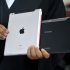 A lawyer holds an Apple iPad and a Samsung Tablet-PC during the court hearing in Dusseldorf, Germany (AP)