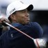 Tiger Woods watches his tee shot on the 18th hole of the north course at the Torrey Pines Golf Course during the second round of the Farmers Insurance Open golf tournament, Friday, Jan. 25, 2013, in San Diego. (AP Photo/Gregory Bull)
