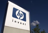 A HP Invent logo is pictured in front of Hewlett-Packard international offices in Meyrin near Geneva August 4, 2009. REUTERS/Denis Balibouse