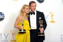Actress Claire Danes, winner of the Emmy for outstanding lead actress in a drama series for "Homeland," left, and actor Damien Lewis, winner of the Emmy for outstanding lead actor in a drama series for "Homeland" pose together backstage at the 64th Primetime Emmy Awards at the Nokia Theatre on Sunday, Sept. 23, 2012, in Los Angeles. (Photo by Jordan Strauss/Invision/AP)