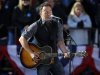 Singer Bruce Springsteen performs before the start of a campaign event for President Barack Obama near the State Capitol Building in Madison, Wis., Monday, Nov. 5, 2012. (AP Photo/Pablo Martinez Monsivais)