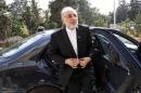 Iranian Foreign Minister Ali Akbar Salehi reacts upon his arrival to attend the official opening ceremony for the new headquarters of the Iranian embassy in Amman