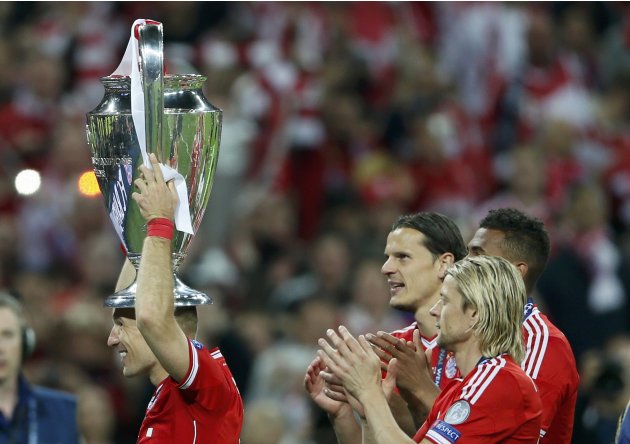 Bayern Munich's Arjen Robben celebrates with the trophy after defeating Borussia Dortmund in their Champions League Final soccer match at Wembley Stadium in London