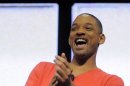 FILE - In this Jan. 9, 2012 file photo, actor Will Smith laughs after viewing a 