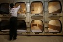 Photos: Tokyo's claustrophobic capsule hotel