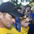 Lance Armstrong walks back to his car after running at Mount Royal park with fans in Montreal