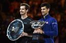Serbia's Novak Djokovic (R) and Britain's Andy Murray (L) hold their trophies during the prize giving ceremony after their singles final on day fourteen of the 2016 Australian Open tennis tournament in Melbourne on January 31, 2016