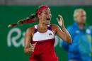 FILE- In this Aug. 13, 2016, file photo, Monica Puig, of Puerto Rico reacts after winning the final point of the gold medal match in the women's tennis competition at the 2016 Summer Olympics in Rio de Janeiro, Brazil. A few weeks ago, Puig was a player outside the top 30 with one career title who had never made it past the fourth round at a major. Now she comes into the U.S. Open as an Olympic gold medalist. (AP Photo/Vadim Ghirda, File)