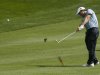 Sterne of South Africa hits a shot from the eighth fairway during the first round of the Dubai Desert Classic at the Emirates Golf Club