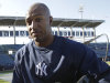 New York Yankees outfielder Vernon Wells  heads to the dugout after signing with the Yankees and taking batting practice before the baseball team's spring training game against the Houston Astros at Steinbrenner Field in Tampa, Fla., Tuesday, March 26, 2013. (AP Photo/Kathy Willens)