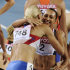 Russia's Tatyana Chernova, left, embraces silver medalist Jessica Ennis of Britain after winning gold in the Heptathlon following the 800m at the World Athletics Championships in Daegu, South Korea, Tuesday, Aug. 30, 2011. (AP Photo/Martin Meissner)