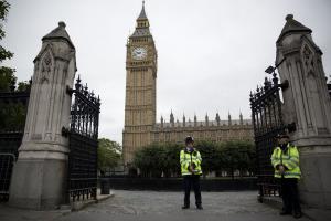British police officers stand guard outside the Houses &hellip;