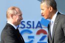 Vladimir Putin (L) welcomes Barack Obama at the start of the G20 summit in Saint Petersburg on September 5, 2013