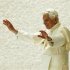 Pope Benedict XVI waves as he leaves after leading his Wednesday general audience in Paul VI's Hall at the Vatican