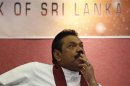 Sri Lanka's President Rajapaksa looks on during the presentation of the 2012 Central Bank of Sri Lanka annual report, in Colombo