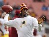 Washington Redskins quarterback Robert Griffin III tosses a ball during warmups before an NFL football game against the Cleveland Browns in Cleveland, Sunday, Dec. 16, 2012. Kirk Cousins will start in place of Griffin wgho is sitting out with a sprained knee. (AP Photo/Rick Osentoski)
