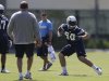 San Diego Chargers rookie linebacker Manti Te'o, right, runs a drill during Chargers training camp Monday, May 20, 2013, in San Diego. (AP Photo/Gregory Bull)