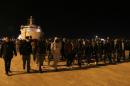 Migrant disembark from a ship of the Italian coast guards on March 4, 2015 in the port of Augusta, Sicily