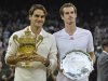 Roger Federer of Switzerland holds his winners trophy and Andy Murray of Britain holds his runners-up trophy after Federer defeated Murray in their men's singles final tennis match at the Wimbledon Tennis Championships in London