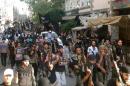 Fighters from the Al-Nusra Front parade south of Damascus, on July 28, 2014
