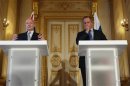 Britain's Foreign Secretary William Hague and Russia's Foreign Minister Sergei Lavrov hold a joint news conference in Lancaster House in central London