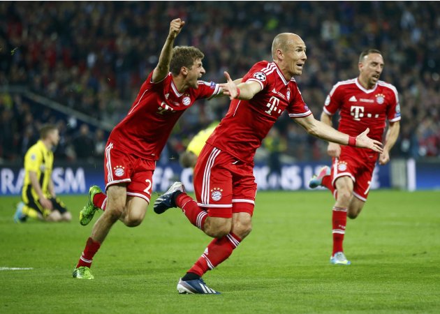 Bayern Munich's Robben, together with team mates Mueller and Ribery, celebrates after scoring the winning goal against Borussia Dortmund during their Champions League Final soccer match at Wembley Sta