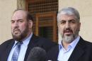 Hamas leader Meshaal and Nazzal, a member of the Hamas leadership, speak to media after their meeting with Jordan's King Abdullah in Amman