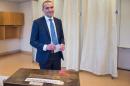 Presidential candidate Gudni Johannesson casts his ballot at a polling station in Reykjavik, on June 25, 2016