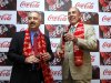 Chairman and CEO of The Coca-Cola Co., Muhtar Kent, right, holds a bottle of Coca Cola and President and CEO of Coca Cola India and South West Asia Atul Singh pose for photos before the start of a meeting in New Delhi, India, Tuesday, June 26, 2012. The world’s biggest beverage maker plans to invest US$5 billion in India from 2012 to 2020. It has already invested more than US$2 billion since re-entering the country in 1993. (AP Photo/Manish Swarup)