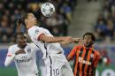 PSG's Zlatan Ibrahimovic, left, controls the ball as Shakhtar's Fred looks him during the Champions League group A soccer match between Shakhtar Donetsk and Paris Saint Germain at the Arena Lviv stadium in Lviv, Western Ukraine, Wednesday, Sept. 30, 2015. (AP Photo/Efrem Lukatsky)
