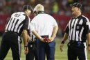 Denver Broncos head coach Fox holds his challenge flag as he talks to referees during play against the Atlanta Falcons during their NFL football game in Atlanta