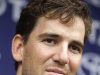 New York Giants quarterback Eli Manning talks to the media during NFL football training camp, Monday, Aug. 15, 2011, East Rutherford, N.J. (AP Photo/Julio Cortez)