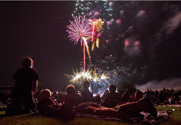 Colourful fireworks explode as spectators watch the Fourth of July celebration at Pioneer Park, Arizona (AP Photo)