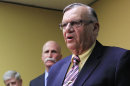 FILE - In this April 3, 2012, file photo, Maricopa County Sheriff Joe Arpaio, right, answers questions as one of his attorney John Masterson, middle, and the Sheriff's Deputy Director Jack MacIntyre, left, listen during a news conference in Phoenix. An audio recording of Arpaio making dismissive comments surfaced as the U.S. Justice Department had already launched a civil rights probe of his trademark immigration patrols and the FBI was already examining abuse-of-power allegations for the sheriff's investigations of political foes. (AP Photo/Ross D. Franklin, File)