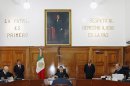 A panel of supreme court justices deliberate the fate of French woman Florence Cassez, whose kidnapping conviction caused international friction and prompted a national debate about the country's troubled legal system, in Mexico City, Wednesday March 21, 2012. The five judges will consider a proposal by fellow justice Arturo Zaldivar, pictured in center, facing camera, to free Cassez because of the inappropriate handling of her case in 2005. Cassez is serving a 60-year sentence. (AP Photo/Marco Ugarte)