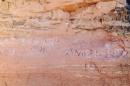 Graffiti is seen scratched into a sandstone wall near Frame Arch in Arches National Park near Moab, Utah