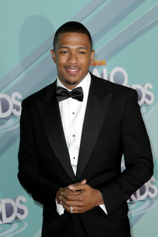 FILE - In this Oct. 26, 2011 photo, Nick Cannon arrives at the third annual TeenNick HALO awards in Los Angeles, Cannon is spending the first week of the new year in the hospital, with wife Mariah Carey by his side. Carey tweeted that Cannon is suffering from ?mild kidney failure.? His rep confirmed his hospitalization Wednesday. He is in Aspen, Colo., where the two were vacationing. Cannon is 31. His rep had no further information about his condition but said he is still hospitalized. (AP Photo/Matt Sayles)