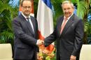 Cuba's President Raul Castro receives his French counterpart Francois Hollande at the Revolution Palace in Havana