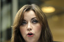 Singer Charlotte Church speaks to the media outside the High Court in London after hearing the reading of a statement setting out the terms of the settlement for phone hacking damages claim against News International, Monday, Feb. 27, 2012. Church, who testified before a media inquiry of being hounded by Rupert Murdoch's journalists when she was a teen singing sensation, received 600,000 pounds ($951,000) Monday in a phone hacking settlement from News International and said she had been sickened by what she had learnt about intrusion into her private life. (AP Photo/Sang Tan)