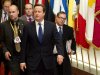 British Prime Minister David Cameron, center, departs after an EU summit in Brussels on Friday, Nov. 23, 2012. The leaders of Britain and France staked out starkly different visions of Europe's future as talks in Brussels on how much the European Union should be allowed to spend, set the stage for a long, divisive and possibly inconclusive summit. (AP Photo/Geert Vanden Wijngaert)